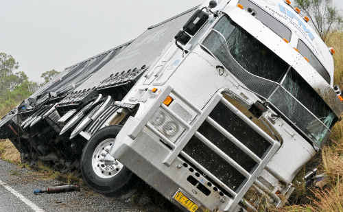 Escape: The driver sustained minor injuries after his Interlink Fright Management truck left the Cunningham Highway early this morning. Escape: The driver sustained minor injuries after his Interlink Fright Management truck left the Cunningham Highway early this morning.